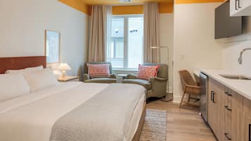 Deluxe Queen | Premium bedding, laptop workspace, blackout drapes, soundproofing