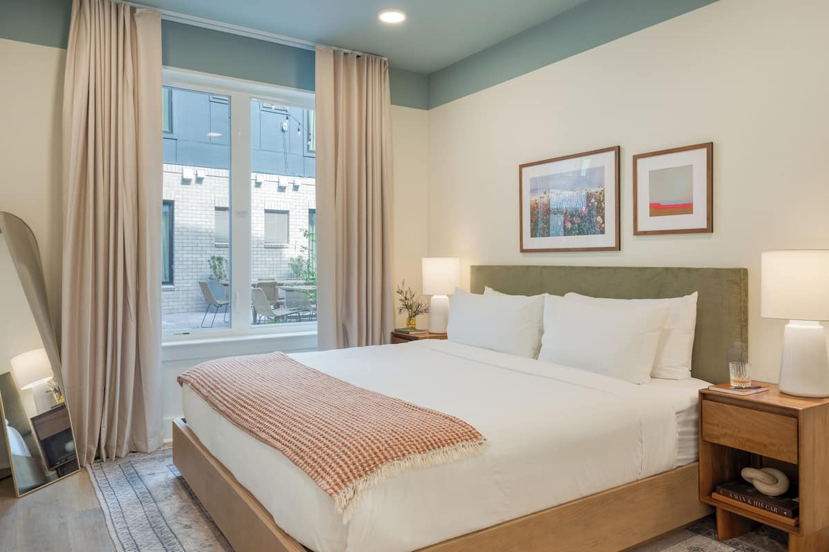 2 bedrooms, premium bedding, laptop workspace, blackout drapes