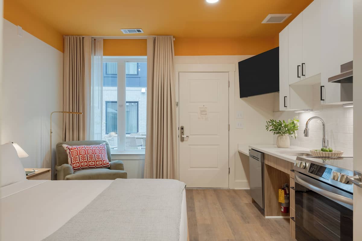 2 bedrooms, premium bedding, laptop workspace, blackout drapes