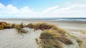 A beach with sand dunes and sparse vegetation. - Gorgeous home in Blessy with heated swimming pool (Blessy)