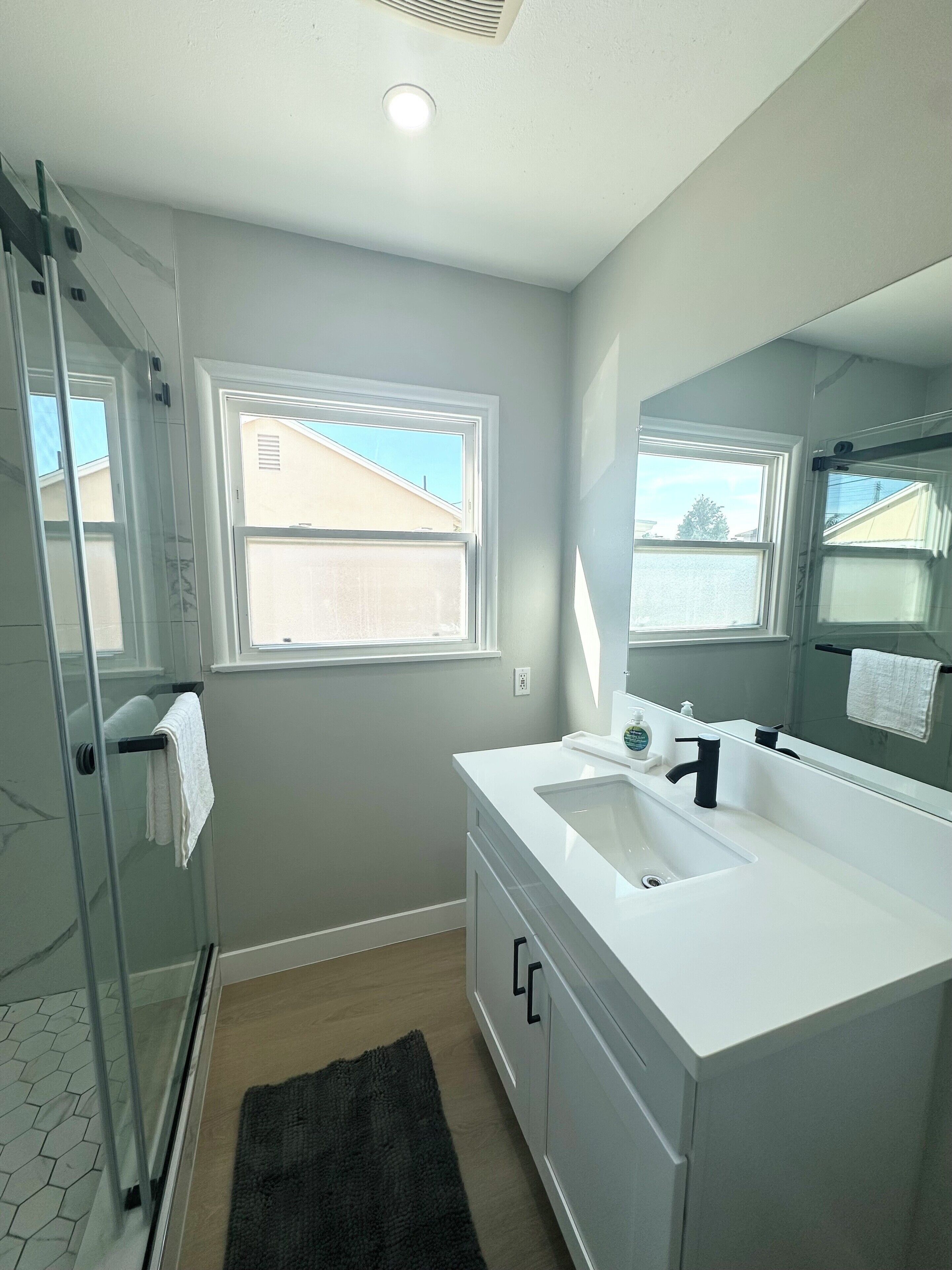 Shower, hair dryer, towels, soap