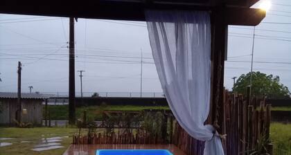 House between the Itapeva lagoon and the Atlantic Forest, romantic and welcoming. RS Towers