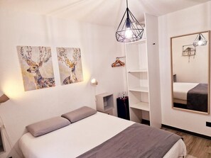 2 dormitorios, escritorio, tabla de planchar con plancha y wifi gratis