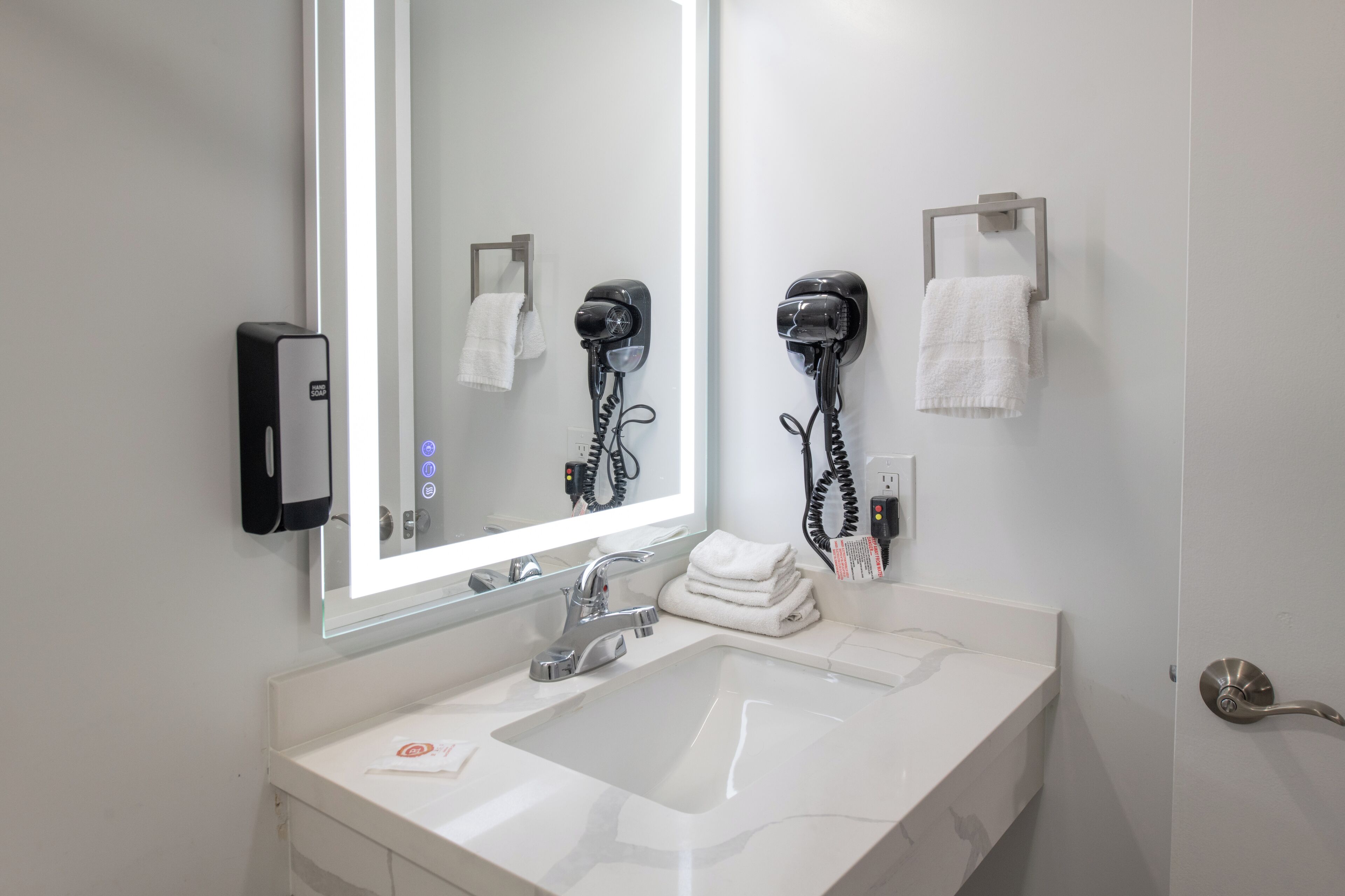 Hair dryer, towels, soap, shampoo