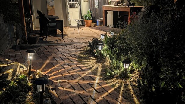 A patio with a brick pathway, outdoor furniture, and potted plants. - European Style b&b in Topanga (Topanga)