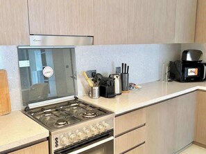 Fridge, microwave, stovetop, coffee/tea maker