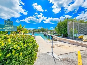 Property grounds - Welcome to REEL HIP!<br><br>Dive into your ultimate Florida Keys retreat at Reel Hip! This stylish waterfront condo offers the perfect blend of coastal charm and modern luxury, complete with a heated pool and a private boat slip for your dream getawa (Marathon)