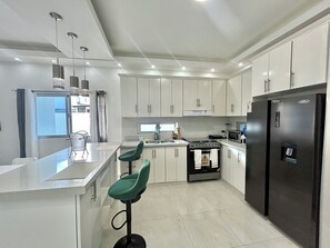 Fridge, microwave, stovetop, coffee/tea maker
