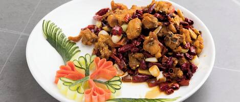 A plate of food with a decorative arrangement of vegetables.