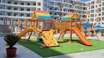 Apartment, 1 Bedroom, Smoking, Pool View | Children's area