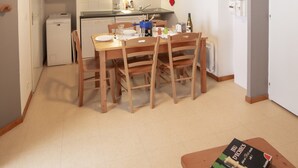 A compact kitchen with a dining area, a microwave, a coffee maker, and a small refrigerator. - Balcons C 001 - Parc Nat. Vanoise Appart. 5 Pers (Val-Cenis)