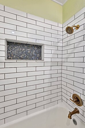 Shower, hair dryer, towels, shampoo