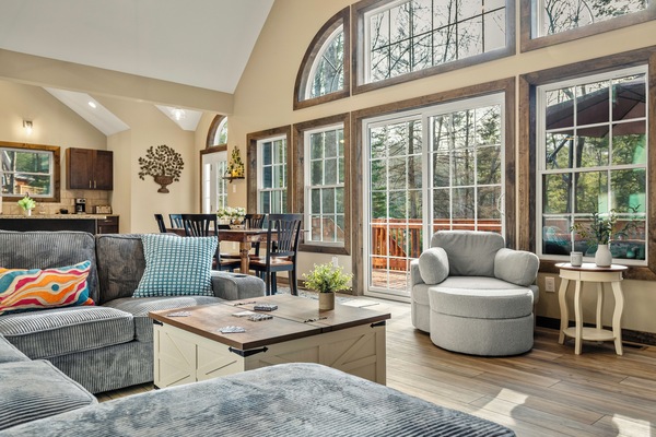 Huge windows and vaulted ceilings in the living area.