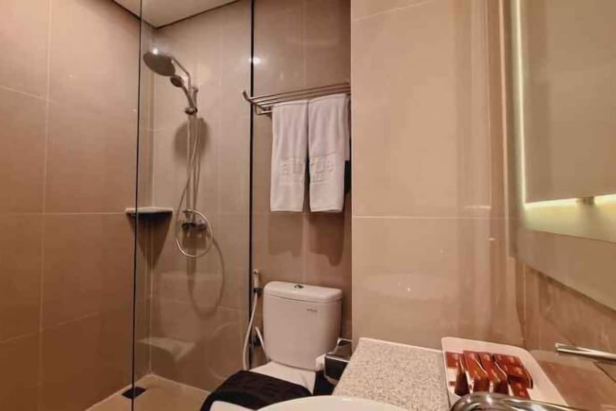 Shower, slippers, towels, soap