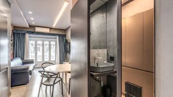 Deluxe Apartment | Living area | TV