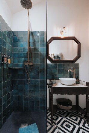 Shower, hair dryer, soap, toilet paper