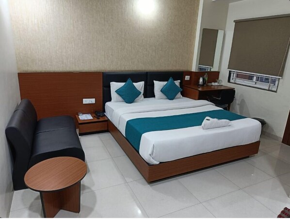 Desk, laptop workspace, blackout curtains, free WiFi