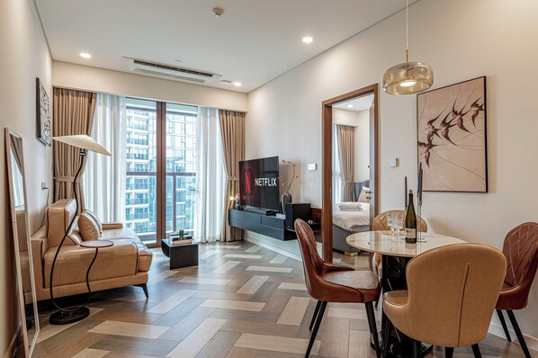 Deluxe Apartment, 1 Bedroom, Balcony, City View | Living area | 40-inch flat-screen TV with cable channels, Netflix, streaming services - The Galleria Residence by Hava  (Ho Chi Minh City)