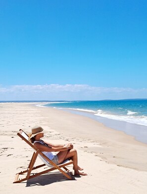 On the beach, sun loungers, beach umbrellas, beach towels