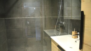 A modern bathroom with a glass shower enclosure, a white sink, and a wooden cabinet. - Veronica Vr51 Nature & Mountain 6 Pers (Chatel)