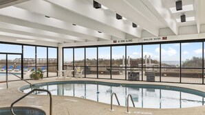 An indoor swimming pool with clear signage indicating shallow water and no diving allowed. - Waterpointe II 705 | Oceanfront 3 Bedroom Condo (North Myrtle Beach)
