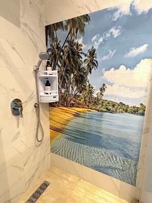 A bathroom with a shower, a sink, and a toilet.