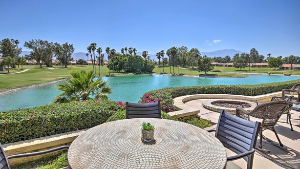 A patio with a round table, chairs, and a small potted plant. - Games, Grill & Golf Course View: Palm Desert Gem! (Palm Desert)