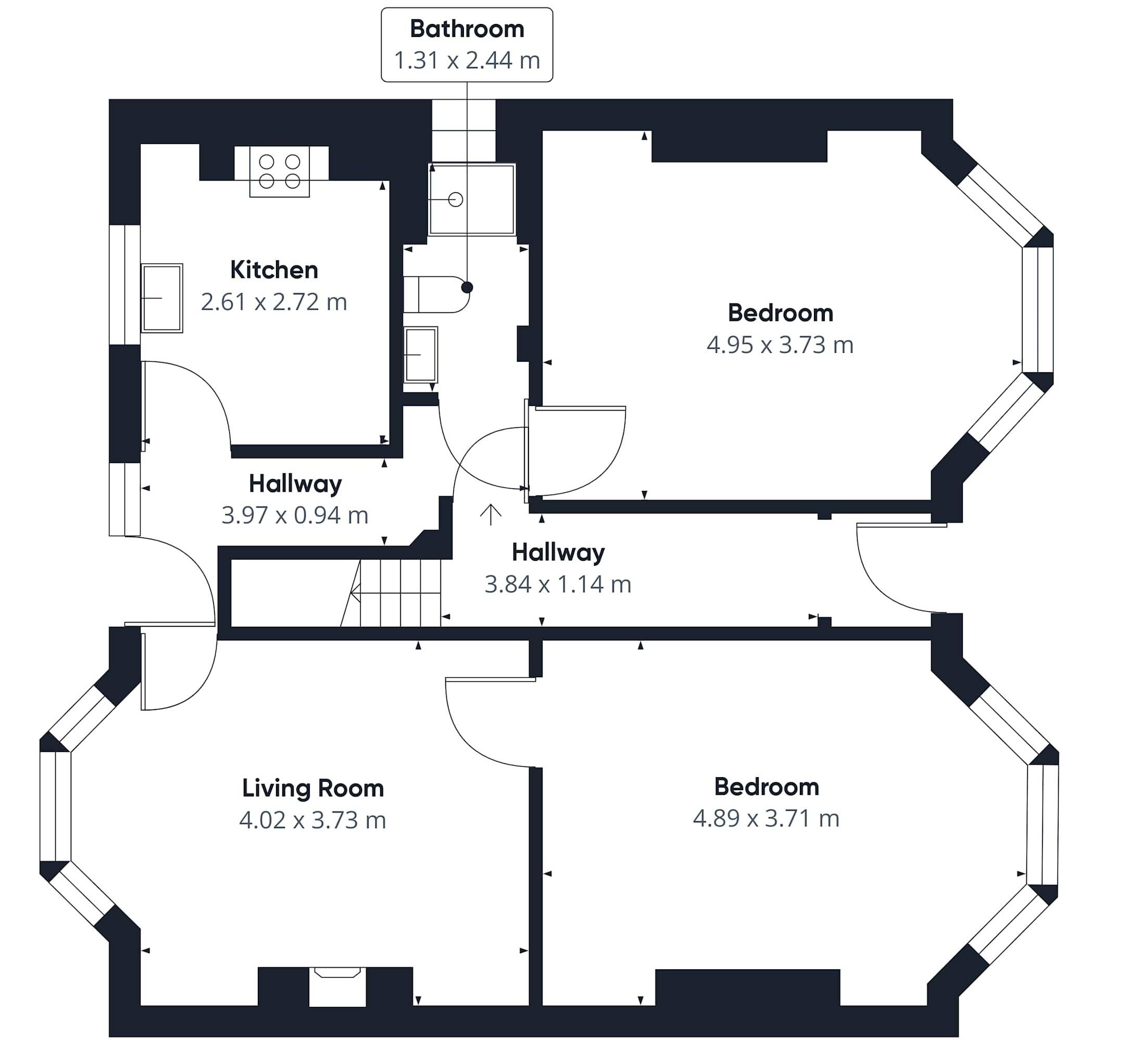 A floor plan with a kitchen, two bedrooms, a bathroom, and two hallways.