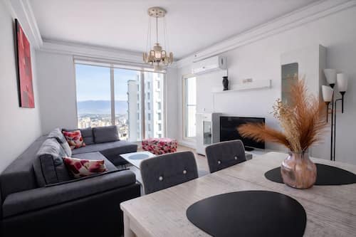 Deluxe Apartment, Balcony, City View | Living area | 43-inch LED TV with cable channels