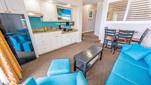 A compact living space with a kitchenette, a dining area with a table and chairs, and a seating area with sofas. - 🌊Oceanfront | Amazing Views | Fabulous Amenities | Beach Cove Resort 1020⛱️ (North Myrtle Beach)