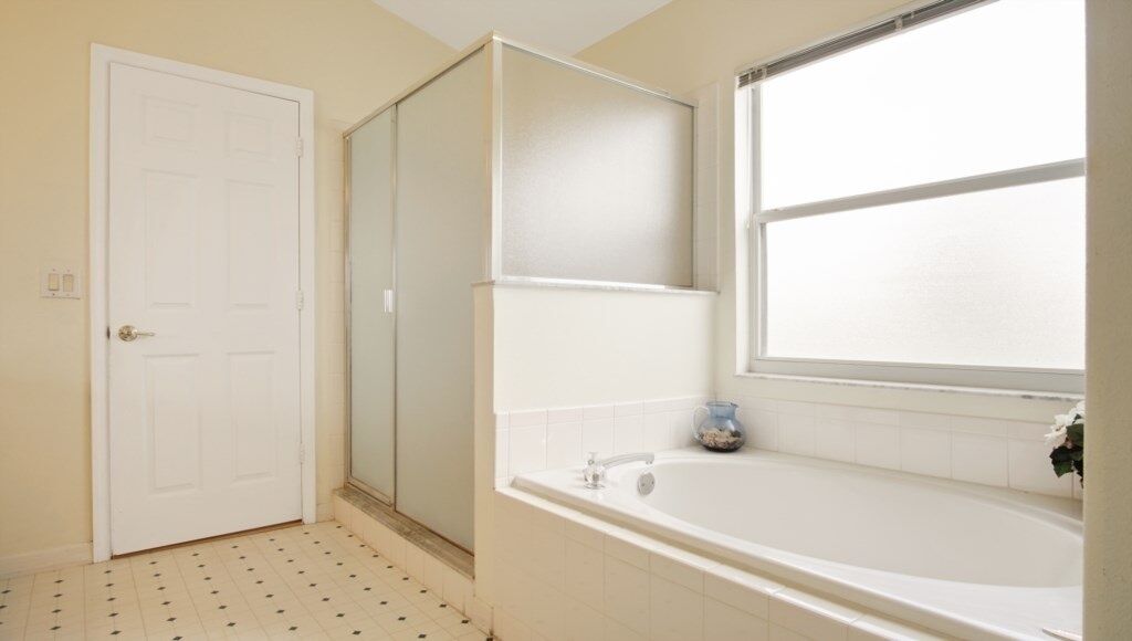 A bathroom with a bathtub, a shower, and a toilet.