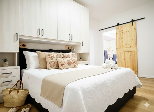 1 habitación y tabla de planchar con plancha 