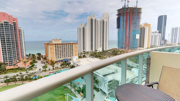 A high-rise building with a view of the ocean and other tall buildings. - PH11 Luxury Ocean View Apartment (Sunny Isles)