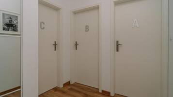 Standard Apartment | Living area | 30-inch flat-screen TV with cable channels