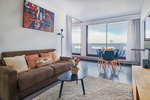 Apartamento, vista para a cidade | Área de estar
