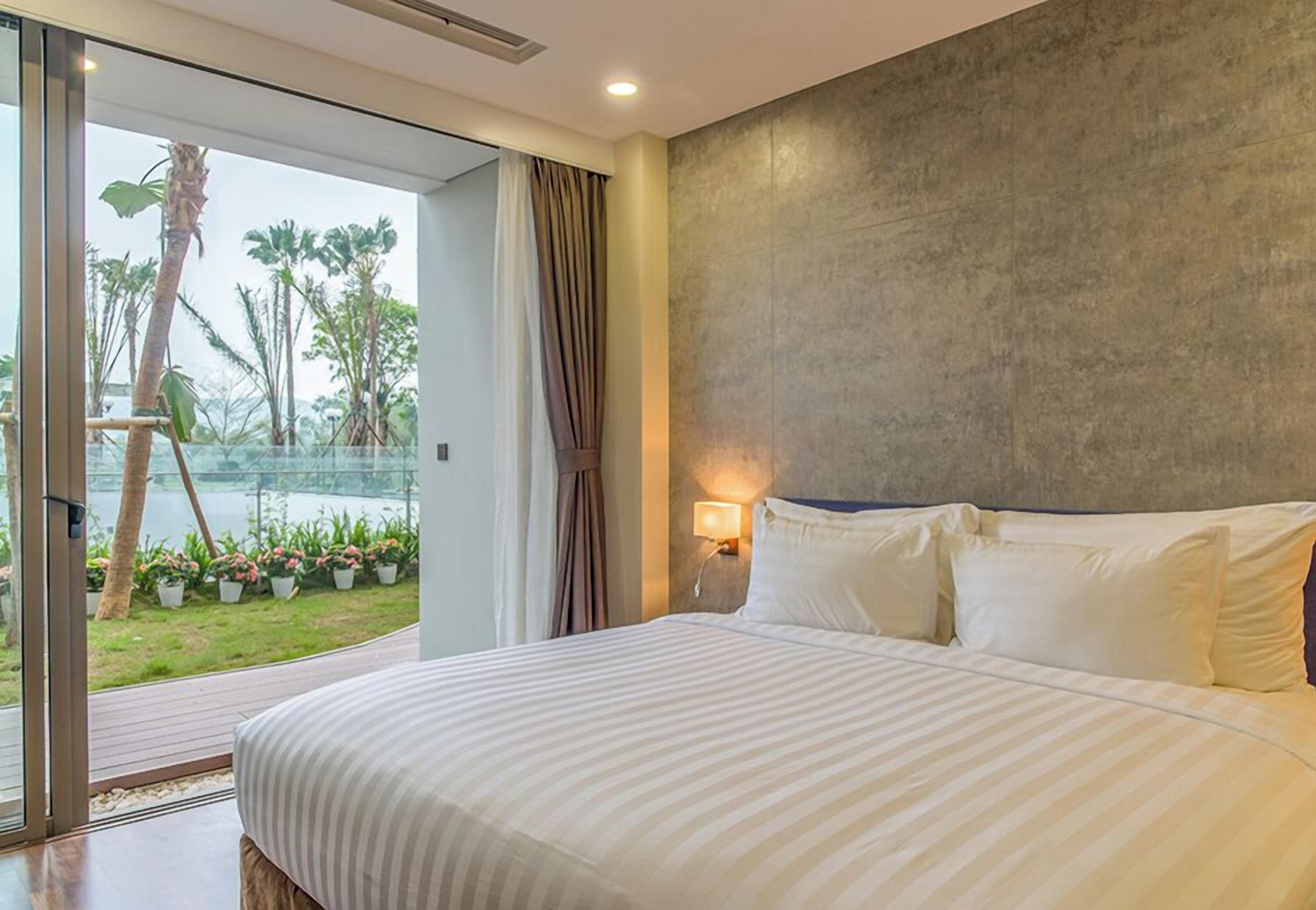 Deluxe Apartment | Living area | 50-inch Smart TV with cable channels