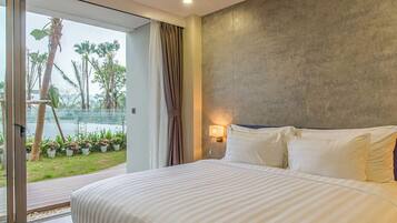 Deluxe Apartment | Living area | 50-inch Smart TV with cable channels