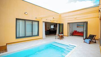 Outdoor pool, a heated pool, pool loungers