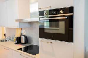 Enjoy cooking in this well-equipped kitchen with an oven and microwave.