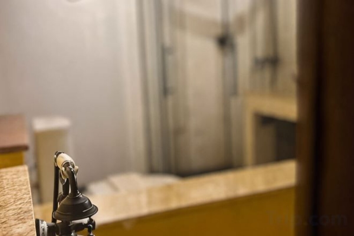 Bathroom | Separate bathtub and shower, free toiletries, hair dryer, slippers