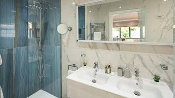 Shower, hair dryer, towels, soap