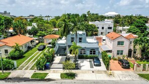 Stunning residential area with diverse architectural styles, lush greenery, and well-manicured lawns.