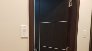 A closed door with a number '3' on it, a light switch on the wall, and a wooden floor. - Room in Guest Room - Serene Retreat in Brampton - Private Room With City Views (Brampton)