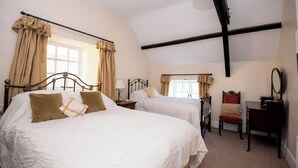A bedroom with two beds, a desk, and a chair. - Luxury and elegant lakeside lodges, Boating activities and pet friendly.
 (Sixmilebridge)