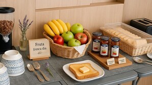 A breakfast setup with fresh fruits, cereals, and spreads on a table. - Xoza Hotel Urban Escape (Cancun)