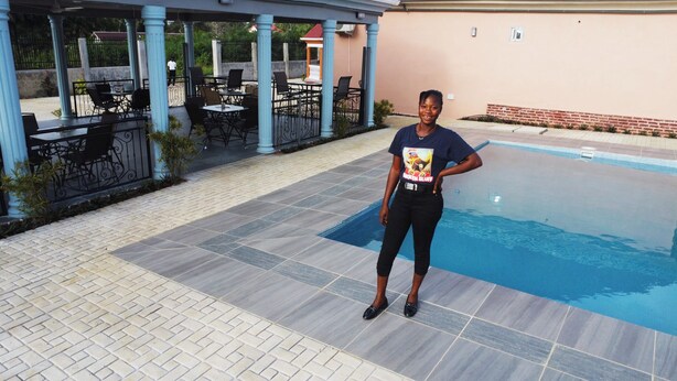 A poolside area with a covered seating area and a pool. - Africa Waka Waka (Lungi)