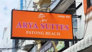 A sign for Arya Suites at Patong Beach.