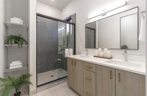 Shower, hair dryer, towels, soap
