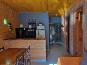 Superior Quadruple Room, Lanai, Hill View | Living area | 28-inch TV with cable channels, fireplace - Pousada Canto da Serra (Lima Duarte)