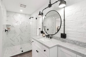 Shower, hair dryer, towels, toilet paper